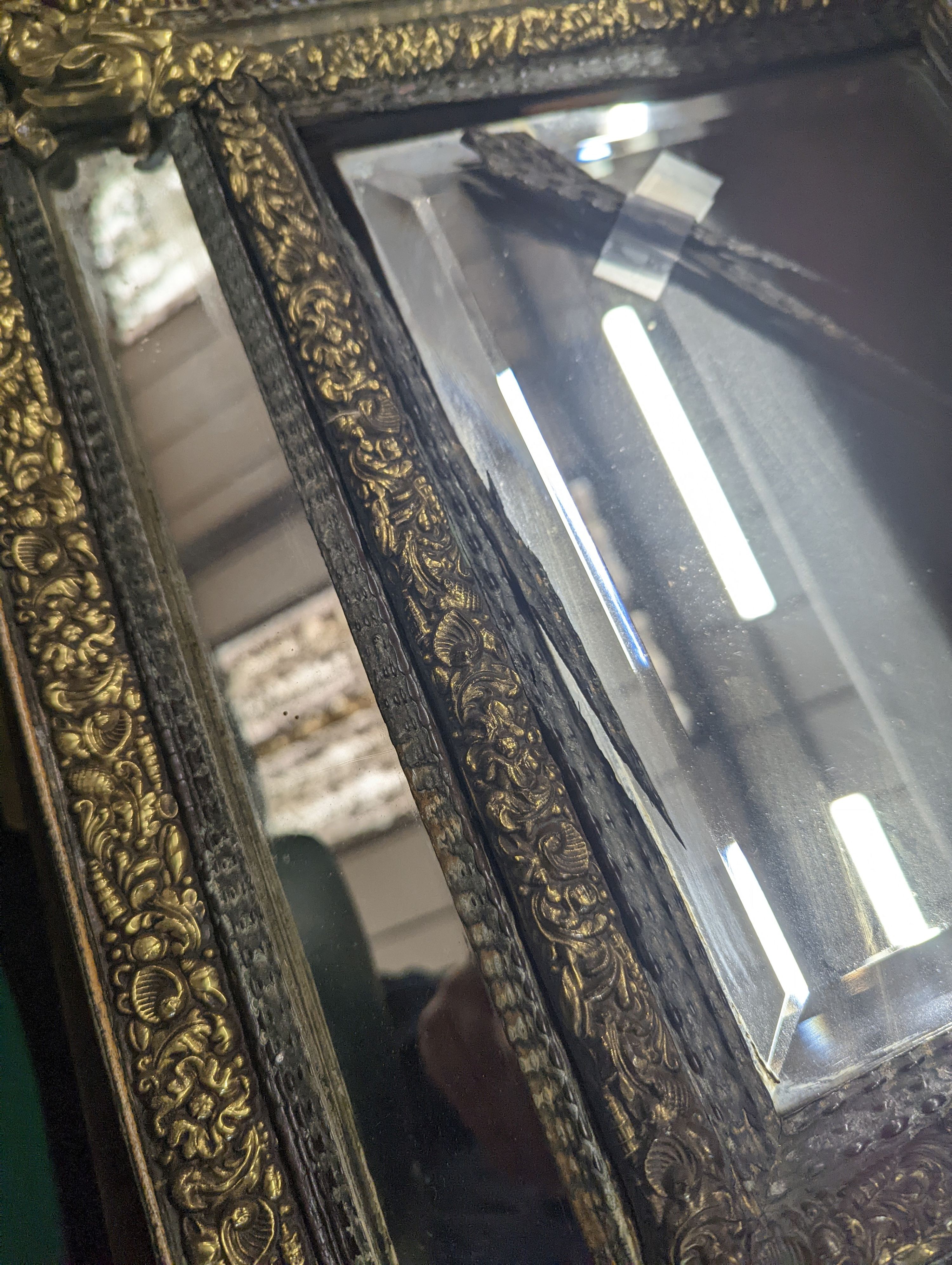 A 19th century Dutch embossed brass wall mirror, width 45cm, height 75cm